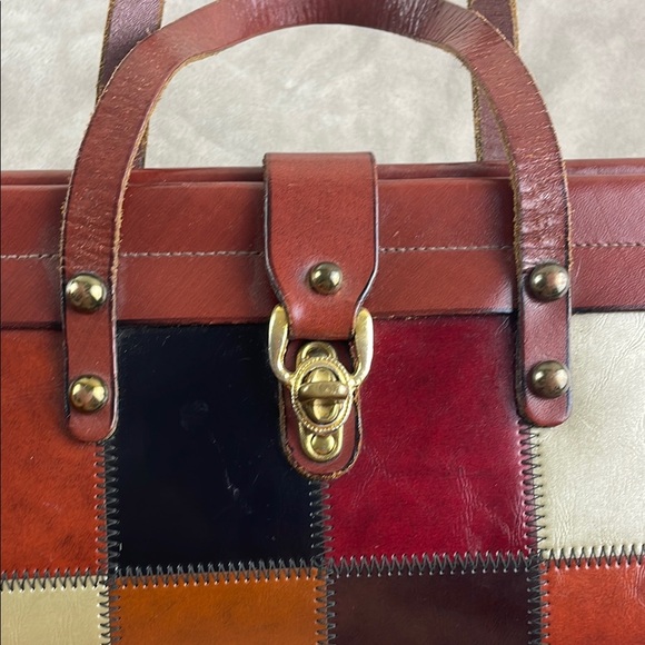 Vintage Brown Satchel with Structured Design and Metal Accents - Picture 3 of 15